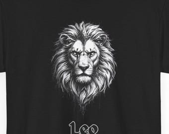 May include: Black t-shirt featuring a detailed, grayscale illustration of a lion's head. The word "Leo" is printed in a stylized font below the image. The design is centered on the shirt.