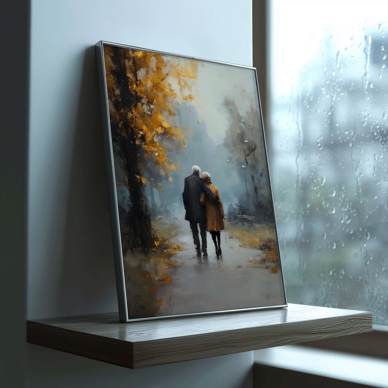 May include: Framed art print depicting an elderly couple strolling along a path in a park. The artwork features a muted color palette with shades of brown, gold, and blue. The couple is embracing, and the scene evokes a sense of peace and tranquility.