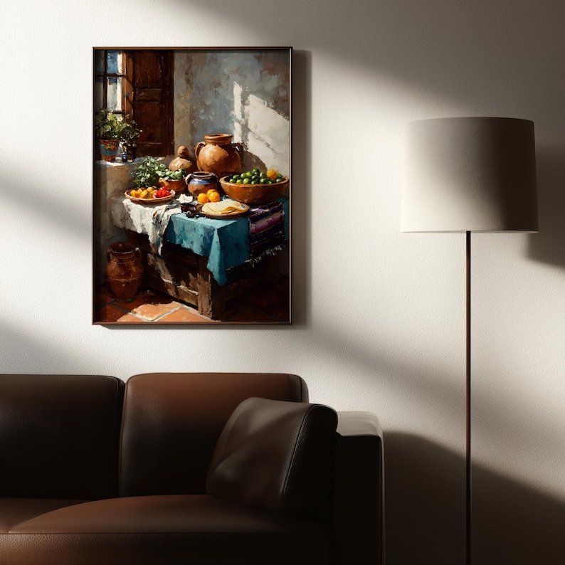 May include: A framed still life painting depicts a table laden with food and pottery. Bowls of green limes and oranges sit alongside plates of tomatoes and tortillas. A blue tablecloth and terracotta pots add color to the scene.