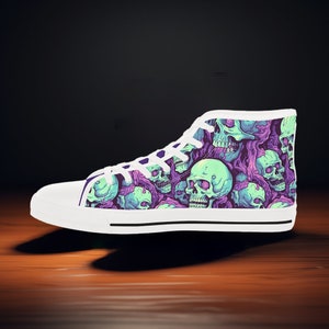 May include: White high-top canvas shoes with a skull pattern. The skulls are green and purple with a white background.
