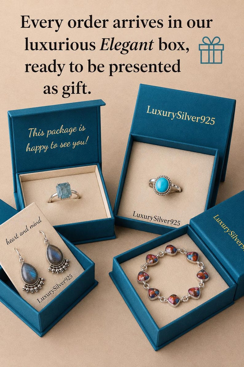 May include: Four teal jewellery boxes containing silver jewellery. One box holds a rectangular blue stone ring, another a round turquoise ring, one a pair of teardrop labradorite earrings, and the last a bracelet with multi-coloured stone links.