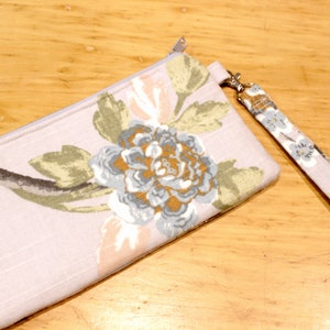 Cartera tipo cartera con cremallera y estampado botánico