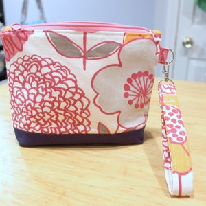 Botanical print zippered wristlet wallet pouch pink, navy, orange image 1