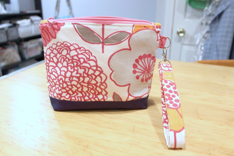 Botanical print zippered wristlet wallet pouch pink, navy, orange image 1