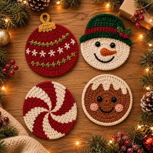 May include: Four round crochet coasters featuring holiday designs: a red ornament with white stitching, a snowman wearing a green hat, a red and white peppermint swirl, and a brown gingerbread person with pink cheeks and white icing details.