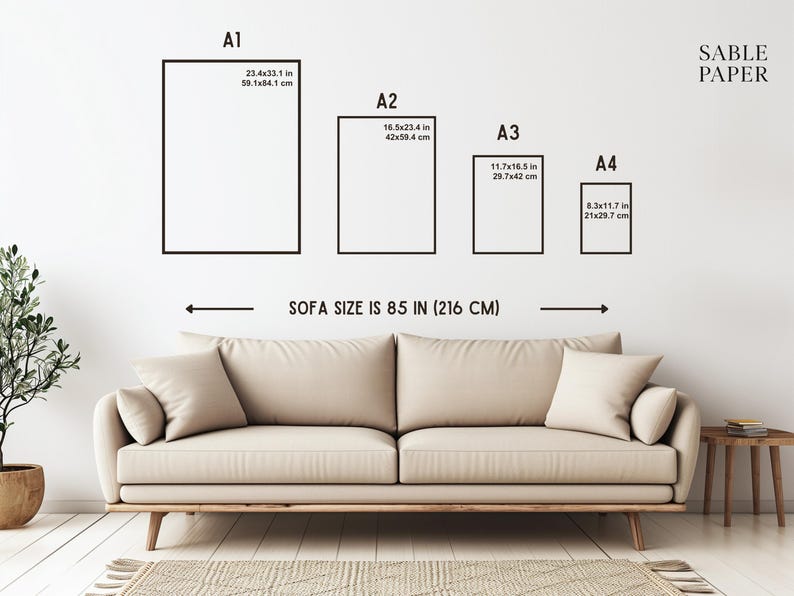 May include: Image showing four rectangular art print sizes: A1 (23.4x33.1 in), A2 (16.5x23.4 in), A3 (11.7x16.5 in), and A4 (8.3x11.7 in). The text indicates a sofa size of 85 in. A beige sofa and a small side table are in the foreground.