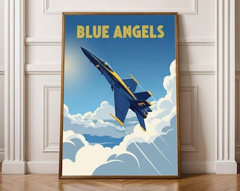 May include: A framed art print featuring a navy blue and yellow jet plane soaring through a blue sky with white clouds. The words "BLUE ANGELS" are in yellow block letters at the top of the print.