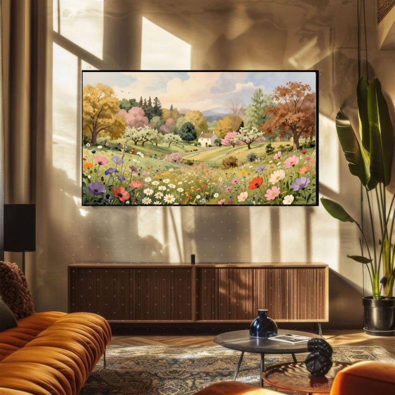 May include: A rectangular wall art print featuring a landscape painting of a rolling meadow filled with colorful wildflowers, including daisies, poppies, and cosmos, leading toward a small house nestled among trees under a soft, cloudy sky.