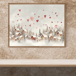 May include: Watercolor painting of a winter village scene with red heart shapes floating in the sky. The artwork features small houses with snow-covered roofs, surrounded by evergreen trees, and framed in a wooden border.