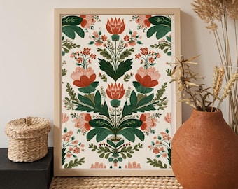 May include: A framed floral art print featuring a symmetrical design of stylized flowers and foliage in shades of red, pink, and green on a cream background. The artwork is displayed in a light wood frame.