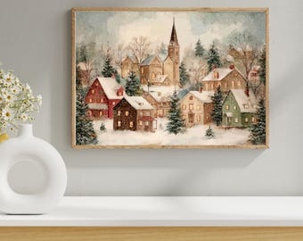 May include: A framed watercolor painting depicts a snow-covered village scene. The artwork features a church with a tall steeple, surrounded by houses and evergreen trees. The color palette includes shades of red, brown, green, and white, creating a cozy winter atmosphere.