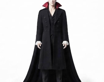 May include: A collectible action figure of a person with dark hair, wearing a long black coat with a high, stiff collar featuring a deep red interior lining. The figure has white ruffled cuffs, a black vest, black trousers, and black shoes.