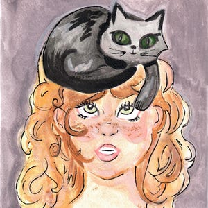 girl with a cat on her head
