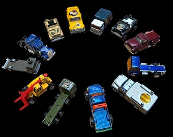 Vintage Diecast Toy Trucks and Utility Vehicles Collection: Lot of 12 by Hot Wheels, Matchbox, and Majorette
