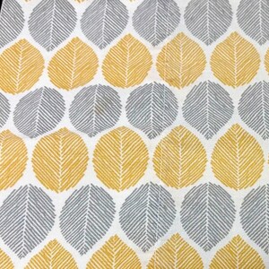 May include: A white fabric featuring a repeating pattern of stylized leaves in alternating rows of mustard yellow and slate gray. Each leaf shape is filled with fine, diagonal line textures that create a consistent, geometric visual rhythm.