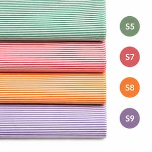May include: Four folded fabric swatches featuring thin horizontal stripes in green, red, orange, and purple. Each swatch is paired with a corresponding circular color label marked S5, S7, S8, and S9, indicating the specific color variant.