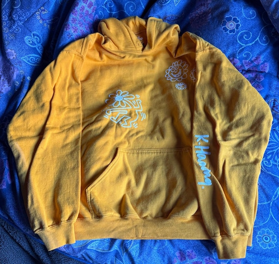 Keith Haring large yellow hooded sweatshirt. Double sided graphics. 50 cotton, 50 polyester. Preowned in Excellent Condition.