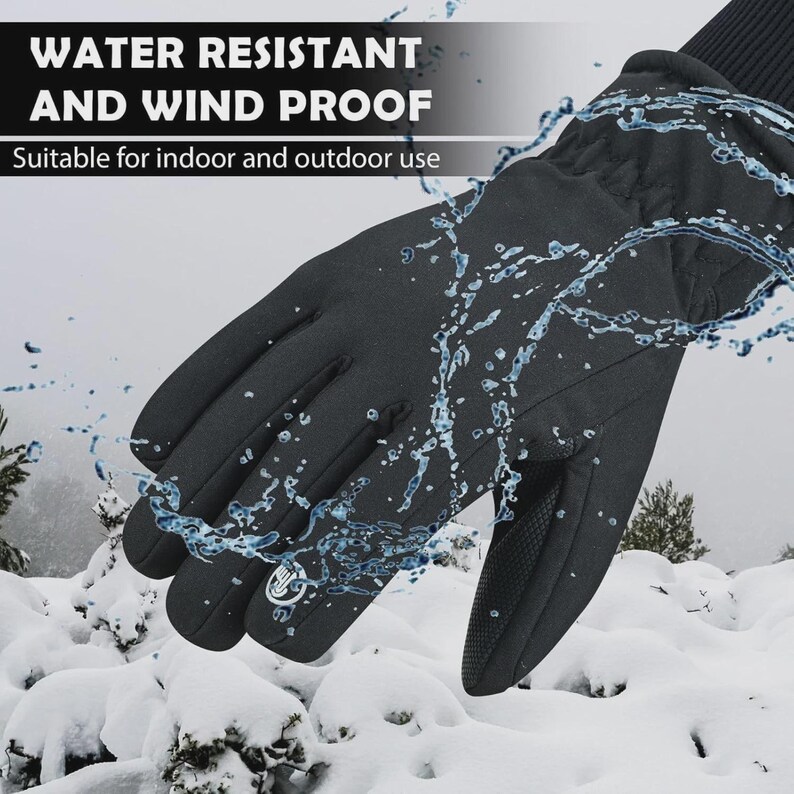 May include: Black gloves with the text "WATER RESISTANT AND WIND PROOF" and "Suitable for indoor and outdoor use". The gloves have a textured palm and are being splashed with water. The background shows snow-covered ground and trees.