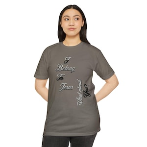 May include: A gray t-shirt with the text "I Belong To Jesus, What about You?" in a stylized font. The shirt is short-sleeved and appears to be made of a soft material. The text is in a gradient color.