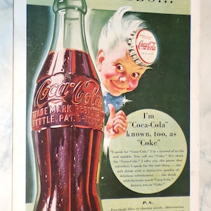 May include: Vintage Coca-Cola advertisement featuring a classic glass bottle filled with the dark red soda. The ad includes the text "Coca-Cola" and a cartoon character with a Coca-Cola bottle cap on their head.