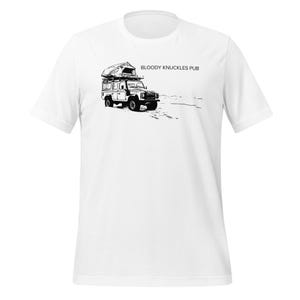 May include: White t-shirt featuring a black and white illustration of a 4x4 vehicle with a rooftop tent. The text "BLOODY KNUCKLES PUB" is printed above the vehicle.