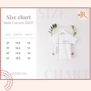 May include: A Bella Canvas 3001T size chart for toddler t-shirts. The chart lists sizes 2T through 5T with corresponding length and width measurements in inches. A white t-shirt on a hanger shows the length and width measurement points.