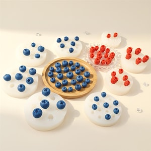 May include: A white ceramic mug with a black handle and the text "But First, Coffee" in a bold, black font. The mug is set against a neutral background, highlighting its simple design.