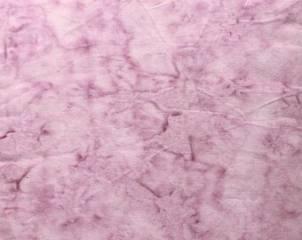 May include: A close-up of a light purple fabric with a marbled pattern. The fabric has a soft, textured feel.