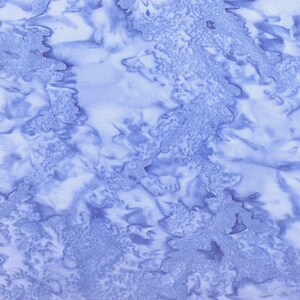 May include: A blue and white abstract pattern with a tie-dye effect. The pattern is made up of swirls and dots.