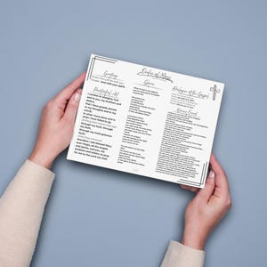 May include: A white printed card featuring the Order of Mass with black text and a cross icon. The document includes sections titled Greeting, Penitential Act, Gloria, Dialogue at the Gospel, and Nicene Creed, all framed by a thin black border.
