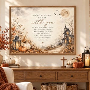 May include: A rectangular wall art print featuring a watercolour-style autumn landscape with a haunted house, pumpkins, a lantern, and bats under a full moon. The text reads: DO NOT BE AFRAID, FOR I AM with you. DO NOT BE DISCOURAGED, FOR I AM YOUR GOD.