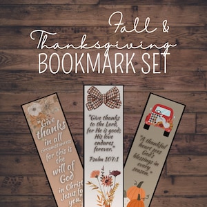 May include: A set of three rectangular bookmarks with fall and Thanksgiving themes. The bookmarks feature floral and truck graphics, and inspirational quotes. The text "Fall & Thanksgiving BOOKMARK SET" is at the top.