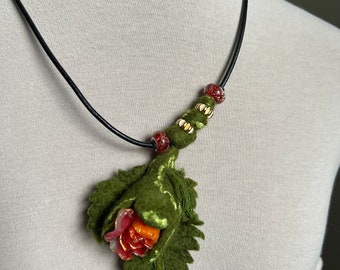green and red wet felted and beaded necklace, cold porcelain flower gives a unique interest to this item.  Only one unique handmade piece.