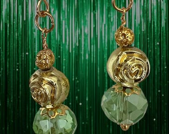 Soft gold and light green colors of this unique handmade earrings bring the spring vibe to your image. Swarovski crystals light and glamour