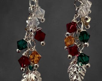 Holiday inspired earrings. silver pine branche and cone decorated with glass green and red ornaments. Handmade