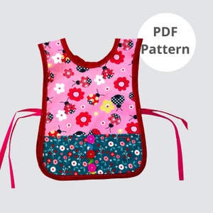 May include: A pink and teal apron with a floral and ladybug pattern. The apron has a red trim and ties, and is decorated with colorful buttons. The text "PDF Pattern" is in a white circle.