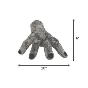 May include: A gray plush hand with black fingernails, measuring 10 inches wide and 6 inches tall. The hand has stitched details and a textured appearance, perfect for Halloween or themed decor.