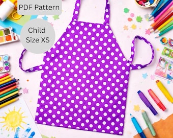 May include: A purple and white polka dot child's apron with the text "PDF Pattern" and "Child Size XS". The apron has a neck loop and waist ties. The image is surrounded by art supplies.