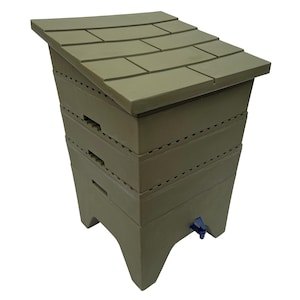 May include: A green composting worm bin with a sloped, shingled roof. The bin is made of stacked sections with ventilation slots and a blue spigot at the base. The bin is designed for composting organic waste.