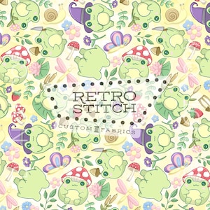 May include: A repeating pattern of light green frogs, mushrooms, butterflies, and flowers on a yellow background. The design includes the text "Retro Stitch Custom Fabrics". The overall theme is whimsical and nature-inspired.