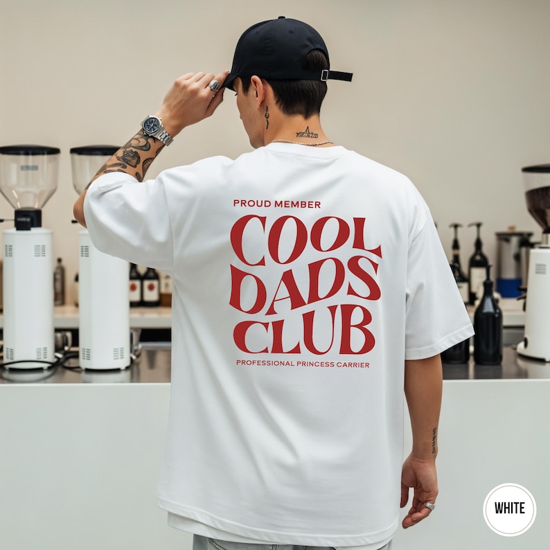 Back view of a white t-shirt with a large red Cool Dads Club graphic and Professional Princess Carrier text.
