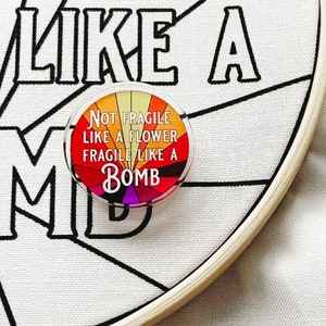 Not Fragile Like a Flower Fragile Like a Bomb | Needle Minder | Modern | sunburst
