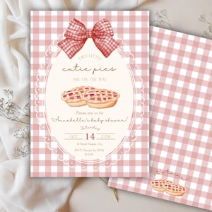 May include: Pink gingham baby shower invitation with a bow and text that reads "Two little cutie pies are on the way." The invitation includes the date, time, and RSVP information. A matching card is also visible.