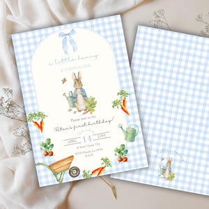 May include: A light blue and white gingham patterned invitation with the text "a little bunny is turning one". The invitation features a watercolor illustration of a bunny, carrots, and a watering can. The back of the invitation has the same gingham pattern.
