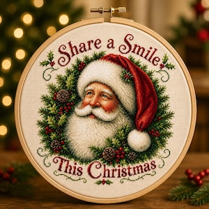 May include: A circular wooden embroidery hoop framing a cross-stitch design of Santa Claus surrounded by a green pine wreath with red berries and pinecones. The text Share a Smile and This Christmas is stitched in red above and below the image.