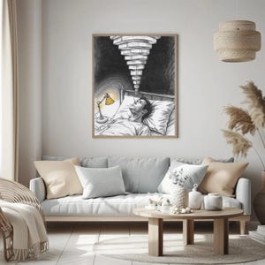 Framed insomnia and anxiety wall art above a light grey sofa in a neutral Scandinavian living room, sketch shows a person lying awake in bed with a yellow bedside lamp and a tunnel of ceiling lights