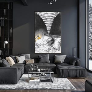 Framed overthinking insomnia wall art above a dark sectional sofa in a moody modern living room, artwork shows a person lying awake in bed with a yellow bedside lamp