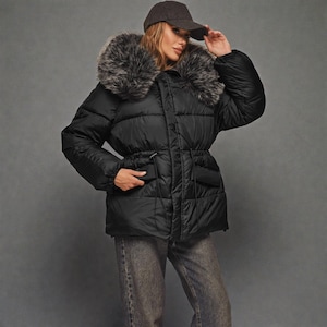 This premium winter collection features water-repellent polyester coats designed for extreme cold. Models include a quilted maxi jacket rated for -15°C with silicone 200 and bio-down puffers handling temperatures down to -20°C. Features include non-removable hoods, detachable fur, and adjustable drawstrings for a custom silhouette. Functional pockets and zip-and-button closures ensure a cozy winter outlook. Stay warm! ❄️🧥