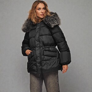 This premium winter collection features water-repellent polyester coats designed for extreme cold. Models include a quilted maxi jacket rated for -15°C with silicone 200 and bio-down puffers handling temperatures down to -20°C. Features include non-removable hoods, detachable fur, and adjustable drawstrings for a custom silhouette. Functional pockets and zip-and-button closures ensure a cozy winter outlook. Stay warm! ❄️🧥