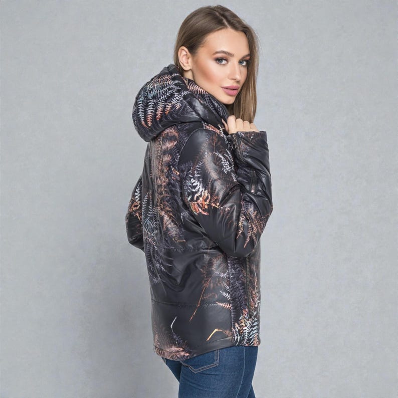 This white puffer jacket blends high-fashion botanical prints with functional design, keeping you comfortable in temperatures down to -5C.

Top Performance Specs
❄️ Insulation: Premium Biosilicone 120 mm for a light down jacket feel.
❄️ Weatherproof: Durable, waterproof raincoat fabric (100% polyester).
❄️ Closure: Unique voluminous diagonal zip puffer coat.
❄️ Collar: High stand-up style for wind protection.
❄️ Utility: Convenient slit pockets and decorative sleeve zippers.
